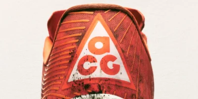 Nike Inc. has officially relaunched its All Conditions Gear (ACG) line as a standalone outdoor performance brand, signalling a strategic shift to deepen its presence in technical trail and outdoor markets. The move includes a renewed focus on trail running, hiking, exploration and other outdoor pursuits, and coincides with plans to open the first ACG-dedicated retail space — the ACG Base Camp — in Beijing’s Taikoo Li Sanlitun shopping district this month. ACG, originally launched in 1989, has a four-decade history as Nike’s specialist label for rugged, performance-oriented gear built to endure diverse environments. After periods of limited activity in recent years, the refreshed ACG reintegrates Nike’s Nike Trail product line and expands its mission to focus squarely on athletes and outdoor enthusiasts who demand gear capable of handling “all conditions.” Outdoor Performance at the Forefront Under the reimagined strategy, ACG’s product range emphasises high-performance footwear and apparel designed for off-road environments. Key offerings include updated trail shoes such as the ACG Ultrafly and ACG Zegama, as well as purpose-built apparel like technical tops and insulated jackets engineered to withstand extreme weather and terrain challenges. Nike has also expanded the All Conditions Racing Department, a collective of elite trail and outdoor athletes who will help shape future product development through real-world testing and performance feedback. Beijing’s ACG Base Camp: More Than Just a Store The first dedicated ACG retail space — dubbed ACG Base Camp — is scheduled to open this month in Taikoo Li Sanlitun, a vibrant Beijing shopping and cultural destination. Far beyond a traditional shop, Nike markets the Base Camp as a “physical manifesto” of the brand’s ethos — a space where community, exploration and gear innovation converge. Nike intends for the Base Camp to act as a hub for the brand’s outdoor narrative, offering immersive experiences and serving as a focal point for trail athletes and outdoor enthusiasts. The concept is expected to evolve over time, with additional activations planned at select Nike stores worldwide. Strategic Context and Industry Impact The ACG relaunch comes amid Nike’s broader “Sports Offense” strategy, which aims to sharpen its focus on core sports performance and reinvigorate sub-brands with meaningful identities that resonate with specialised athlete communities. By consolidating trail and outdoor performance under the ACG banner, Nike looks to compete more directly with established outdoor brands while reinforcing its technical innovation narrative. Analysts see the decision as part of Nike’s efforts to reinvigorate growth in categories that blend lifestyle appeal with authentic athletic performance — and to deepen engagement in key regions, particularly Asia, where outdoor sports participation and premium gear demand have been rising.