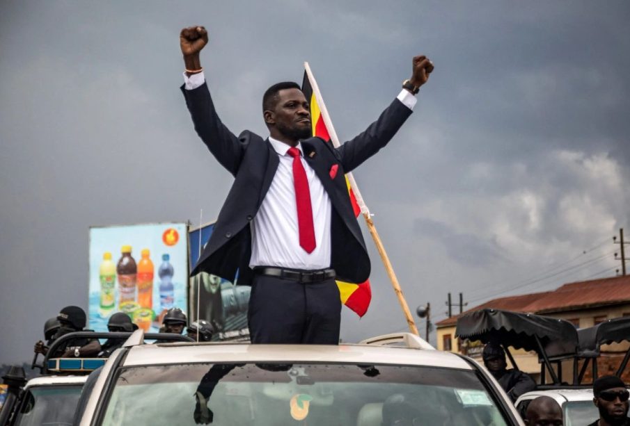 Bobi Wine with his hands up
