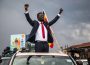 Bobi Wine with his hands up