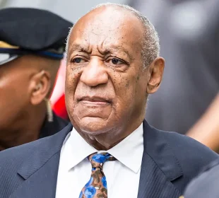 Bill Cosby surrounded by the police