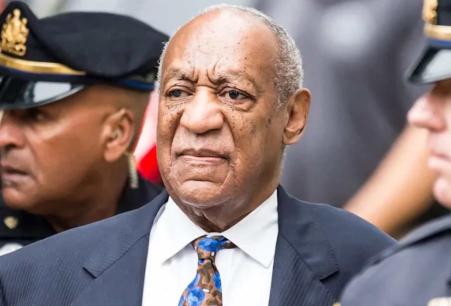 Bill Cosby surrounded by the police