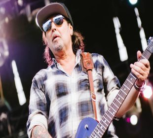 Phil Campbell playing a guitar
