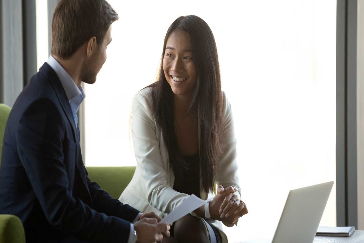 A manager checking in on an employee