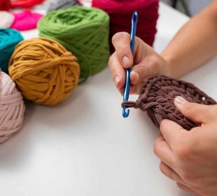 A lady knitting showing the healing power of knitting