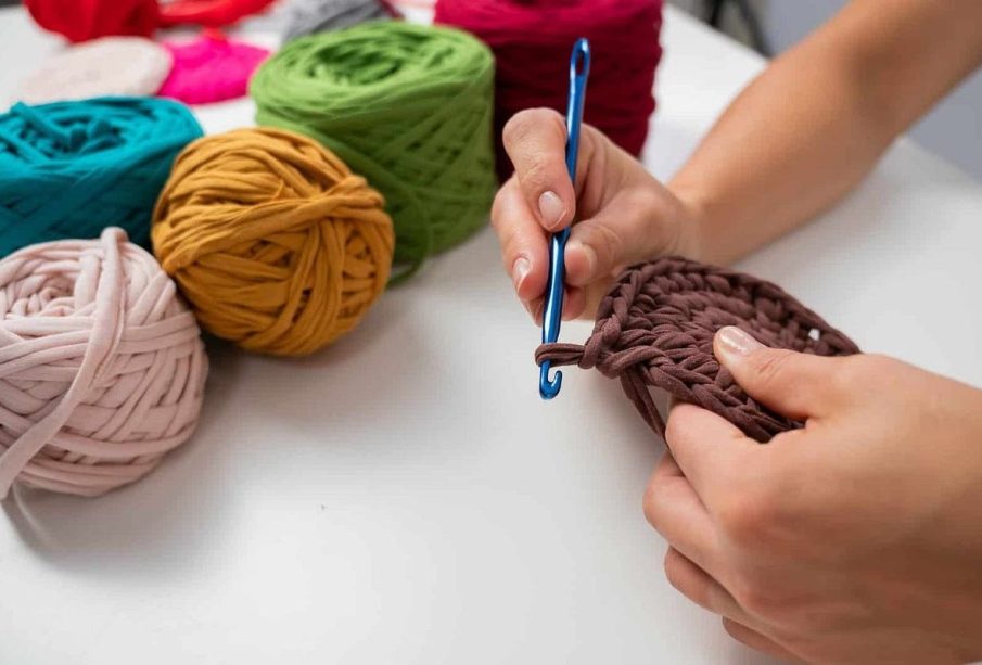 A lady knitting showing the healing power of knitting