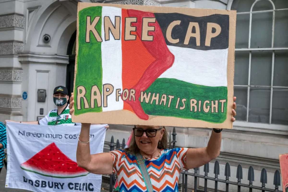 Protesters supporting rapper kneecap