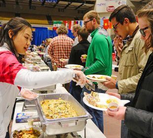 A lady serving food in a food festivals