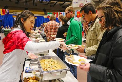 A lady serving food in a food festivals