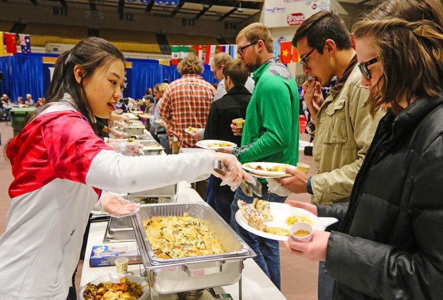 A lady serving food in a food festivals