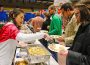 A lady serving food in a food festivals