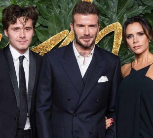 David and Lady Victoria Beckham with son at an event