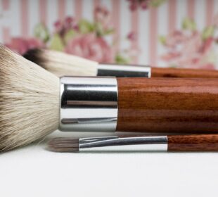 a pair of makeup brushes