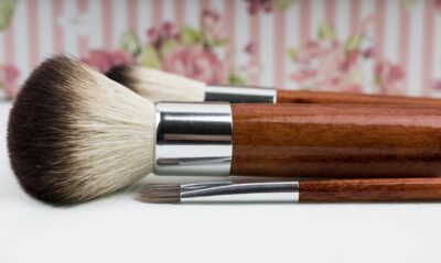 a pair of makeup brushes