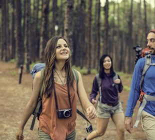 Friends Hanging out at Destination Camp with travel gadgets