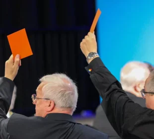 Men raising cards up in support of same sex marriage