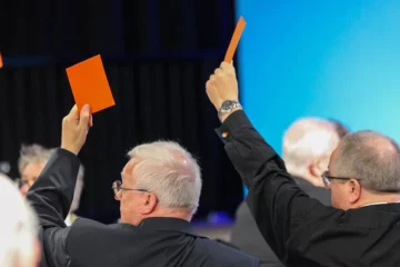 Men raising cards up in support of same sex marriage