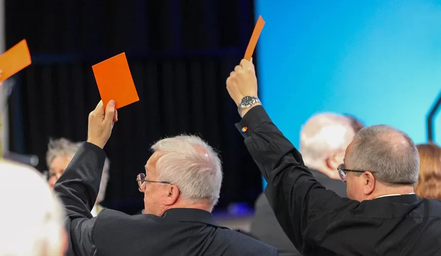 Men raising cards up in support of same sex marriage