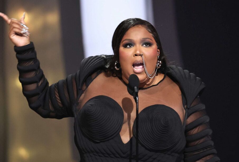 Lizzo giving a speech on stage