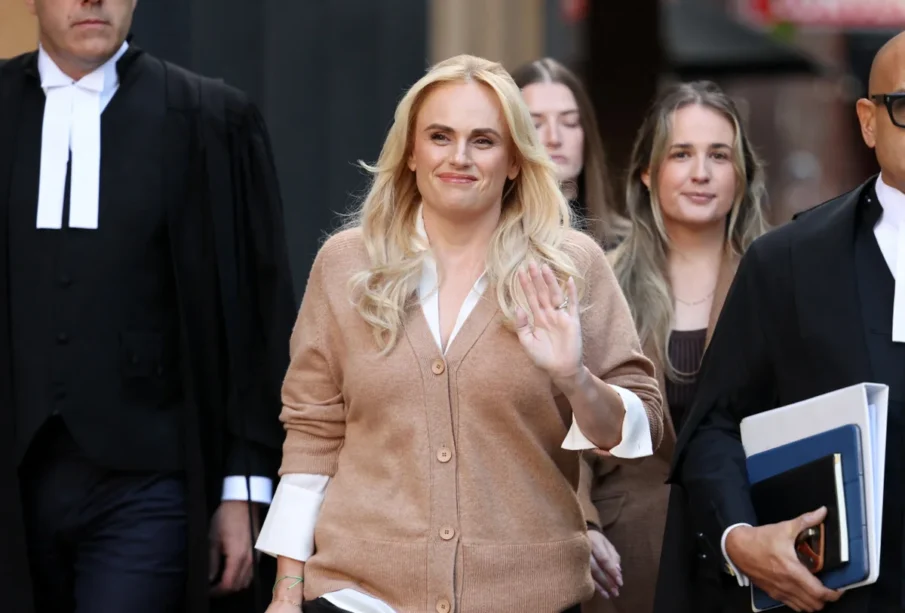 Rebel Wilson with lawyers by her sides