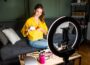 Beauty influencer demonstrating skincare routine on camera while reviewing products that influence skincare buying habits in the UK beauty market.